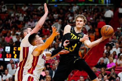 Mar 13, 2023; Miami, Florida, USA; Utah Jazz forward Lauri Markkanen (23) throws a pass as Miami Heat guard Tyler Herro (14) defends during the second quarter at Miami-Dade Arena. Mandatory Credit: Rich Storry-USA TODAY Sports