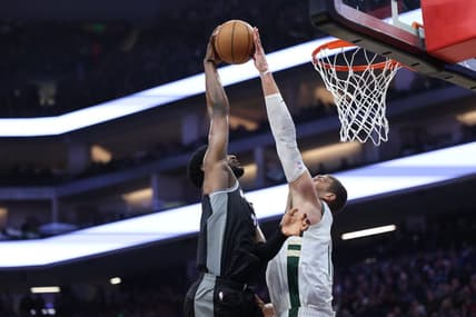 Mar 13, 2023; Sacramento, California, USA; Milwaukee Bucks center Brook Lopez (11) blocks the shot of Sacramento Kings power forward Chimezie Metu (7) during the first quarter at Golden 1 Center. Mandatory Credit: Kelley L Cox-USA TODAY Sports