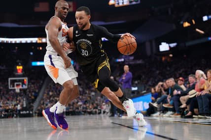 Mar 13, 2023; San Francisco, California, USA; Golden State Warriors guard Stephen Curry (30) dribbles the ball next to Phoenix Suns guard Chris Paul (3) in the second quarter at the Chase Center. Mandatory Credit: Cary Edmondson-USA TODAY Sports
