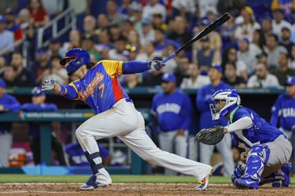 Mar 14, 2023; Miami, Florida, USA; Venezuela third baseman Eugenio Suarez (7) hits a two-run single during the fourth inning against Nicaragua at LoanDepot Park. Mandatory Credit: Sam Navarro-USA TODAY Sports