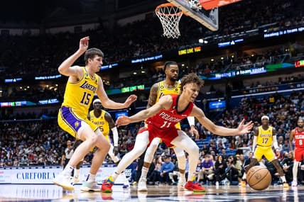 Mar 14, 2023; New Orleans, Louisiana, USA; New Orleans Pelicans guard Dyson Daniels (11) looses the ball out of bounds against Los Angeles Lakers guard Austin Reaves (15) during the first half at Smoothie King Center. Mandatory Credit: Stephen Lew-USA TODAY Sports