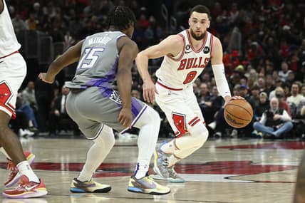 Mar 15, 2023; Chicago, Illinois, USA; Chicago Bulls guard Zach LaVine (8) moves the ball past Sacramento Kings guard Davion Mitchell (15) during the first half at the United Center. Mandatory Credit: Matt Marton-USA TODAY Sports