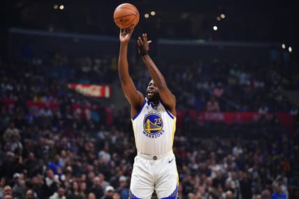 Mar 15, 2023; Los Angeles, California, USA; Golden State Warriors forward Draymond Green (23) shoots against the Los Angeles Clippers during the first half at Crypto.com Arena. Mandatory Credit: Gary A. Vasquez-USA TODAY Sports