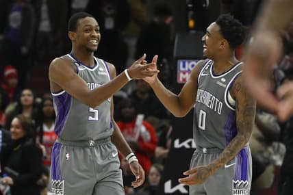 Mar 15, 2023; Chicago, Illinois, USA; Sacramento Kings guard De'Aaron Fox (5) celebrates with guard Malik Monk (0) after Fox made a three-point basket to defeat the Chicago Bulls at the United Center. Mandatory Credit: Matt Marton-USA TODAY Sports