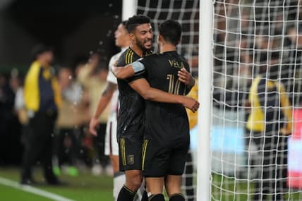 Mar 15, 2023; Los Angeles, CA, USA; LAFC forward Carlos Vela (10) celebrates with forward Denis Bouanga (99) after scoring a goal against the Alajuelense in the second half at BMO Stadium. Mandatory Credit: Kirby Lee-USA TODAY Sports