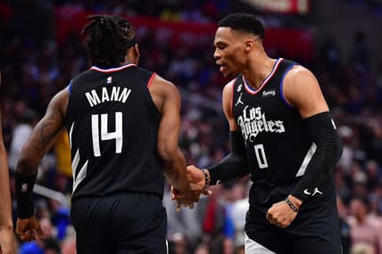 Mar 15, 2023; Los Angeles, California, USA; Los Angeles Clippers guard Russell Westbrook (0) reacts after guard Terance Mann (14) scores a basket and draws the foul against the Golden State Warriors during the second half at Crypto.com Arena. Mandatory Credit: Gary A. Vasquez-USA TODAY Sports