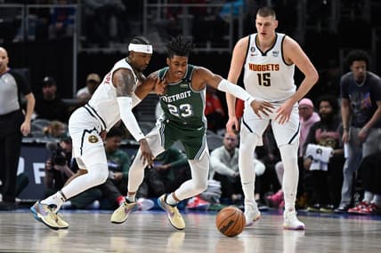 Mar 16, 2023; Detroit, Michigan, USA; Denver Nuggets guard Kentavious Caldwell-Pope (5) (left) knocks the ball away from Detroit Pistons guard Jaden Ivey (23) as Denver Nuggets center Nikola Jokic (15) watches in the first quarter at Little Caesars Arena. Mandatory Credit: Lon Horwedel-USA TODAY Sports