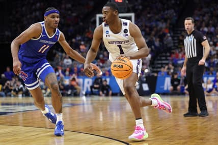 Mar 16, 2023; Sacramento, CA, USA;  Northwestern Wildcats guard Chase Audige (1) controls the ball against Boise State Broncos forward Chibuzo Agbo (11) in the second half at Golden 1 Center. Mandatory Credit: Kelley L Cox-USA TODAY Sports