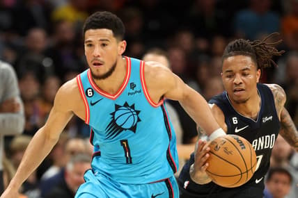 Mar 16, 2023; Phoenix, Arizona, USA; Orlando Magic guard Markelle Fultz (right) steals the ball from Phoenix Suns guard Devin Booker in the first half at Footprint Center. Mandatory Credit: Mark J. Rebilas-USA TODAY Sports