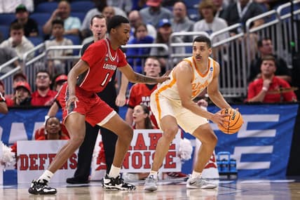 Mar 16, 2023; Orlando, FL, USA; Tennessee Volunteers guard Tyreke Key (4) controls the ball while defended by Louisiana Ragin Cajuns forward Joe Charles (1) during the first half at Amway Center. Mandatory Credit: Matt Pendleton-USA TODAY Sports