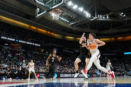 Mar 17, 2023; Albany, NY, USA; St. Mary's Gaels center Mitchell Saxen (11) drives to the basket against Virginia Commonwealth Rams forward David Shriver (35) during the first half at MVP Arena. Mandatory Credit: David Butler II-USA TODAY Sports