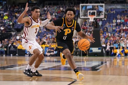 Mar 17, 2023; Greensboro, NC, USA; /p0/ dribbles the ball while defended by Iowa State Cyclones guard Tamin Lipsey (3) during the first half at Greensboro Coliseum. Mandatory Credit: Bob Donnan-USA TODAY Sports