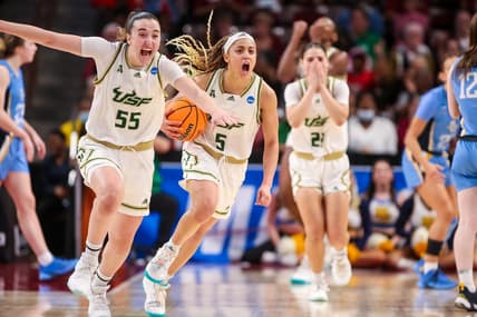 Mar 17, 2023; Columbia, SC, USA; South Florida Bulls guard Carla Brito (55) and guard Elena Tsineke (5) celebrate their win over the Marquette Golden Eagles in the first round of the 2023 NCAA Division 1 women   s basketball tournament at Colonial Life Arena. Mandatory Credit: Jeff Blake-USA TODAY Sports