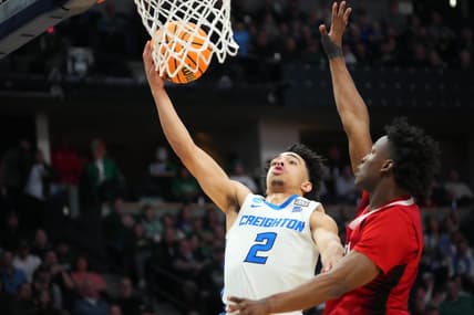 Mar 17, 2023; Denver, CO, USA;  Creighton Bluejays guard Ryan Nembhard (2) drives to the basket as North Carolina State Wolfpack guard Jarkel Joiner (1) defends during the second half in the first round of the 2023 NCAA men   s basketball tournament at Ball Arena. Mandatory Credit: Ron Chenoy-USA TODAY Sports
