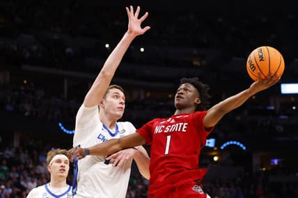 Mar 17, 2023; Denver, CO, USA;  North Carolina State Wolfpack guard Jarkel Joiner (1) shoots for the basket as Creighton Bluejays center Ryan Kalkbrenner (11) defends during the second half in the first round of the 2023 NCAA men   s basketball tournament at Ball Arena. Mandatory Credit: Michael Ciaglo-USA TODAY Sports