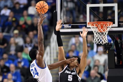 Mar 17, 2023; Greensboro, NC, USA;  Kentucky Wildcats forward Oscar Tshiebwe (34) shoots against Providence Friars forward Ed Croswell (5) in the first half at Greensboro Coliseum. Mandatory Credit: Bob Donnan-USA TODAY Sports