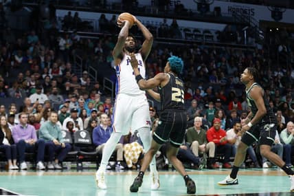 Mar 17, 2023; Charlotte, North Carolina, USA; Philadelphia 76ers center Joel Embiid (21) shoots over Charlotte Hornets forward Kai Jones (23) during the first half at Spectrum Center. Mandatory Credit: Brian Westerholt-USA TODAY Sports