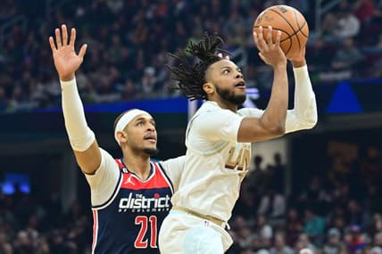 Mar 17, 2023; Cleveland, Ohio, USA; Cleveland Cavaliers guard Darius Garland (10) drives to the basket against Washington Wizards center Daniel Gafford (21) during the first half at Rocket Mortgage FieldHouse. Mandatory Credit: Ken Blaze-USA TODAY Sports