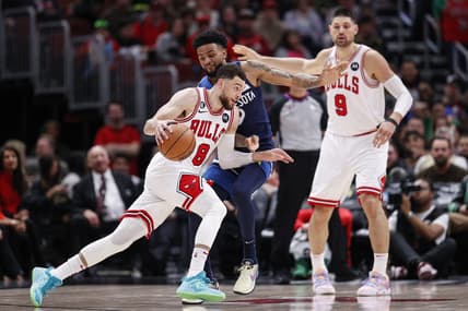 Mar 17, 2023; Chicago, Illinois, USA; Chicago Bulls guard Zach LaVine (8) drives to the basket against Minnesota Timberwolves guard Nickeil Alexander-Walker (9) during the second half at United Center. Mandatory Credit: Kamil Krzaczynski-USA TODAY Sports
