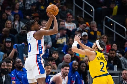 Mar 18, 2023; Indianapolis, Indiana, USA; Philadelphia 76ers guard Tyrese Maxey (0) shoots the ball while  Indiana Pacers guard Andrew Nembhard (2) defends in the second quarter at Gainbridge Fieldhouse. Mandatory Credit: Trevor Ruszkowski-USA TODAY Sports