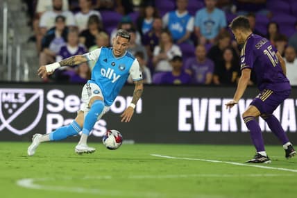 Mar 18, 2023; Orlando, Florida, USA; Charlotte FC forward Enzo Copetti (9) takes on Orlando City SC defender Rodrigo Schlegel (15) during the first half at Exploria Stadium. Mandatory Credit: Nathan Ray Seebeck-USA TODAY Sports