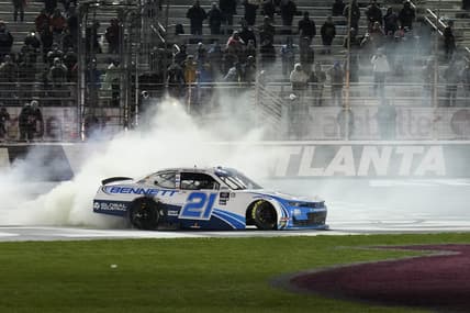 Mar 18, 2023; Hampton, Georgia, USA; NASCAR Xfinity Series driver Austin Hill (21) does a celebratory burn at Atlanta Motor Speedway. Mandatory Credit: David Yeazell-USA TODAY Sports