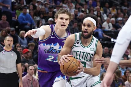 Mar 18, 2023; Salt Lake City, Utah, USA; Boston Celtics guard Derrick White (9) drives on Utah Jazz forward Lauri Markkanen (23) in the first quarter at Vivint Arena. Mandatory Credit: Rob Gray-USA TODAY Sports