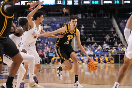 Mar 19, 2023; Greensboro, NC, USA; Pittsburgh Panthers forward Guillermo Diaz Graham (25) drives to the basket against Xavier Musketeers forward Cesare Edwards (4) during the first half in the second round of the 2023 NCAA men   s basketball tournament at Greensboro Coliseum. Mandatory Credit: Bob Donnan-USA TODAY Sports