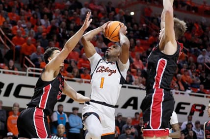 Oklahoma State Cowboys guard Bryce Thompson (1) puts up a shot between Eastern Washington Eagles forward Angelo Allegri (13), left,  and forward Dane Erikstrup (32) during a college basketball game between the Oklahoma State Cowboys (OSU) and the Eastern Washington Eagles in the second round of the NIT at Gallagher-Iba Arena in Stillwater, Okla., Sunday, March 19, 2023.

Osu Nit