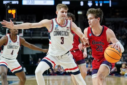 Mar 19, 2023; Albany, NY, USA; St. Mary s Gaels guard Aidan Mahaney (20) dribbles the ball against UConn Huskies guard Joey Calcaterra (3) during the first half at MVP Arena. Mandatory Credit: David Butler II-USA TODAY Sports