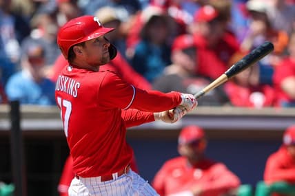 Mar 20, 2023; Clearwater, Florida, USA;  Philadelphia Phillies first baseman Rhys Hoskins (17) hits a two-run home run against the Baltimore Orioles in the second inning during spring training at BayCare Ballpark. Mandatory Credit: Nathan Ray Seebeck-USA TODAY Sports