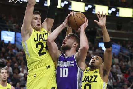 Mar 20, 2023; Salt Lake City, Utah, USA; Sacramento Kings forward Domantas Sabonis (10) goes to the basket between Utah Jazz center Walker Kessler (24) and guard Talen Horton-Tucker (0) in the first quarter at Vivint Arena. Mandatory Credit: Rob Gray-USA TODAY Sports