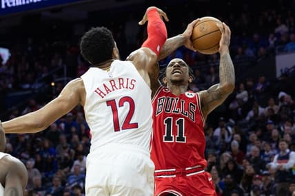Mar 20, 2023; Philadelphia, Pennsylvania, USA; Chicago Bulls forward DeMar DeRozan (11) drives for a shot against Philadelphia 76ers forward Tobias Harris (12) during overtime at Wells Fargo Center. Mandatory Credit: Bill Streicher-USA TODAY Sports