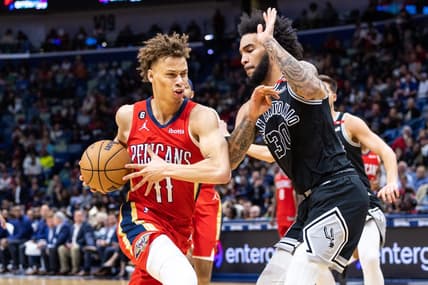 Mar 21, 2023; New Orleans, Louisiana, USA; New Orleans Pelicans guard Dyson Daniels (11) dribbles against San Antonio Spurs forward Julian Champagnie (30)  during the second half at Smoothie King Center. Mandatory Credit: Stephen Lew-USA TODAY Sports