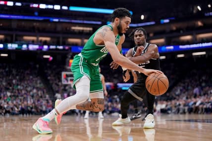 Mar 21, 2023; Sacramento, California, USA; Boston Celtics forward Jayson Tatum (0) dribbles past Sacramento Kings guard Davion Mitchell (15) in the second quarter at the Golden 1 Center. Mandatory Credit: Cary Edmondson-USA TODAY Sports
