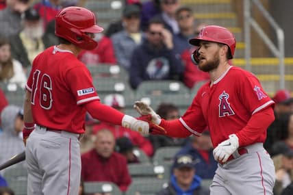 Mar 22, 2023; Salt River Pima-Maricopa, Arizona, USA; Los Angeles Angels first baseman Jared Walsh (20) celebrates after hitting a solo home run against the Colorado Rockies with center fielder Mickey Moniak (16) in the second inning at Salt River Fields at Talking Stick. Mandatory Credit: Rick Scuteri-USA TODAY Sports