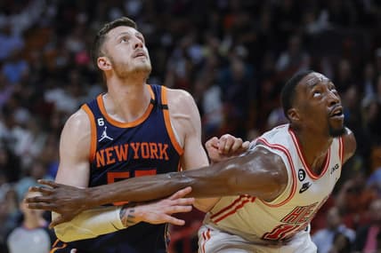 Mar 22, 2023; Miami, Florida, USA; New York Knicks center Isaiah Hartenstein (55) and Miami Heat center Bam Adebayo (13) defend during a free-throw attempt in the second quarter at Miami-Dade Arena. Mandatory Credit: Sam Navarro-USA TODAY Sports