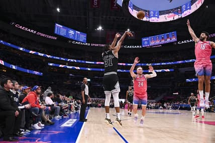 Mar 24, 2023; Washington, District of Columbia, USA;  San Antonio Spurs forward Keita Bates-Diop (31) shoots as W forward Corey Kispert (24) and Washington Wizards forward Anthony Gill (16) slides to defend during the first half at Capital One Arena. Mandatory Credit: Tommy Gilligan-USA TODAY Sports
