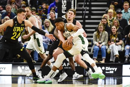 Mar 24, 2023; Salt Lake City, Utah, USA; Milwaukee Bucks forward Giannis Antetokounmpo (34) drives into Utah Jazz forward/center Kelly Olynyk (41) during the first half at Vivint Arena. Mandatory Credit: Christopher Creveling-USA TODAY Sports