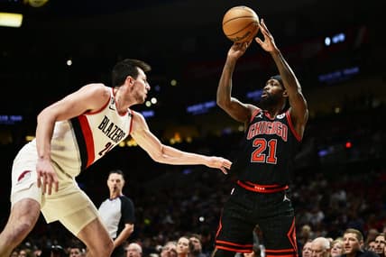Mar 24, 2023; Portland, Oregon, USA; Chicago Bulls guard Patrick Beverley (21) passes the ball during the first half against Portland Trail Blazers forward Drew Eubanks (24) at Moda Center. Mandatory Credit: Troy Wayrynen-USA TODAY Sports
