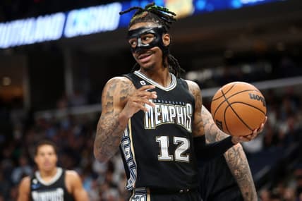 Mar 24, 2023; Memphis, Tennessee, USA; Memphis Grizzlies guard Ja Morant (12) collects the ball during the first half against the Houston Rockets at FedExForum. Mandatory Credit: Petre Thomas-USA TODAY Sports