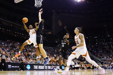 Mar 24, 2023; Kansas City, MO, USA; Texas Longhorns guard Sir'Jabari Rice (10) attempts a shot against Xavier Musketeers forward Jack Nunge (24) during the first half of an NCAA tournament Midwest Regional semifinal at T-Mobile Center. Mandatory Credit: Jay Biggerstaff-USA TODAY Sports