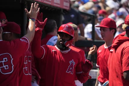 Mar 25, 2023; Tempe, Arizona, USA; Los Angeles Angels second baseman Luis Rengifo (2) celebrates with teammates after scoring against the Chicago Cubs in the third inning at Tempe Diablo Stadium. Mandatory Credit: Rick Scuteri-USA TODAY Sports