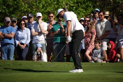 Mar 25, 2023; Austin, Texas, USA; Scotty Scheffler chips from the fairway at the sixteenth hole in a match against Jason Day during the fourth round of the World Golf Championships-Dell Technologies Match Play golf tournament. Mandatory Credit: Dustin Safranek-USA TODAY Sports