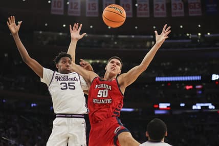 Mar 25, 2023; New York, NY, USA; Kansas State Wildcats forward Nae'Qwan Tomlin (35) and Florida Atlantic Owls center Vladislav Goldin (50) fight for the ball during the second half of an NCAA tournament East Regional final at Madison Square Garden. Mandatory Credit: Brad Penner-USA TODAY Sports