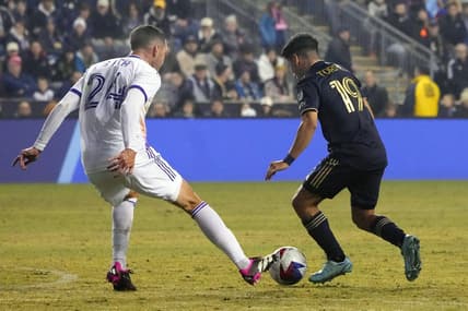 Mar 25, 2023; Philadelphia, Pennsylvania, USA; Philadelphia Union midfielder Joaquin Torres (19) and Orlando City SC defender Kyle Smith (24) battle for the ball in the first half at Subaru Park. Mandatory Credit: Gregory Fisher-USA TODAY Sports