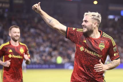 Mar 25, 2023; Kansas City, Kansas, USA; Seattle Sounders forward Jordan Morris (13) celebrates after scoring a goal during the second half against the Sporting Kansas City at Children's Mercy Park. Mandatory Credit: William Purnell-USA TODAY Sports