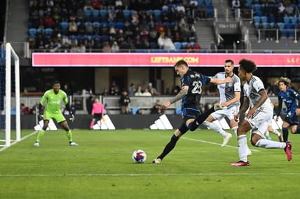Mar 25, 2023; San Jose, California, USA; San Jose Earthquakes forward Benji Kikanovic (28) kicks the ball against Toronto FC goalkeeper Sean Johnson (1) during the first half at PayPal Park. Mandatory Credit: Robert Edwards-USA TODAY Sports