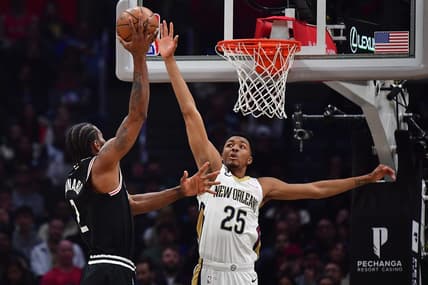 Mar 25, 2023; Los Angeles, California, USA; Los Angeles Clippers forward Kawhi Leonard (2) shoots against New Orleans Pelicans guard Trey Murphy III (25) during the first half at Crypto.com Arena. Mandatory Credit: Gary A. Vasquez-USA TODAY Sports