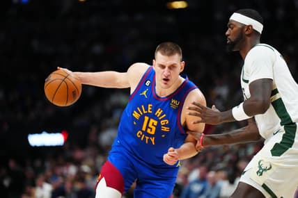 Mar 25, 2023; Denver, Colorado, USA; Denver Nuggets center Nikola Jokic (15) drives at Milwaukee Bucks forward Bobby Portis (9) during the second half at Ball Arena. Mandatory Credit: Ron Chenoy-USA TODAY Sports